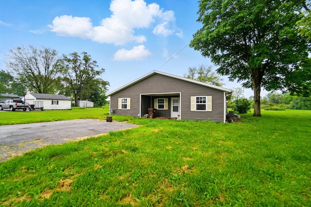1324 Glenn Ave, Lima, OH 45806 - view of front facade with a front lawn and driveway