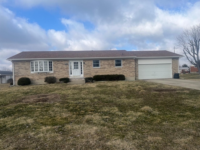 ranch-style home featuring a front lawn, concrete driveway, brick siding, and an attached garage