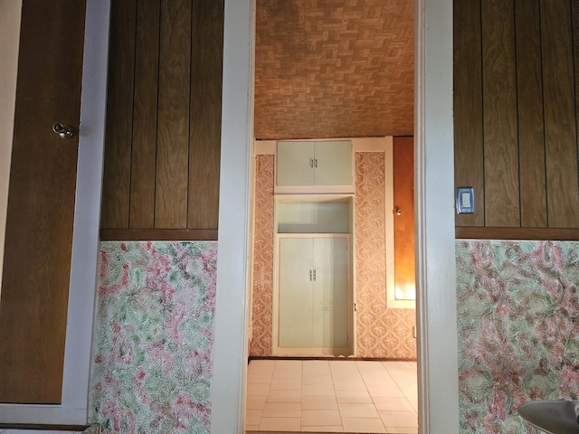 bathroom featuring wallpapered walls