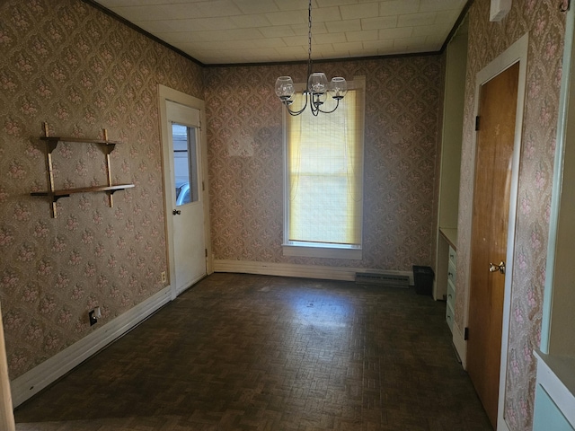 unfurnished dining area with an inviting chandelier, wallpapered walls, and baseboards