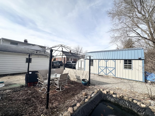 view of yard with a storage shed, a gazebo, and an outdoor structure