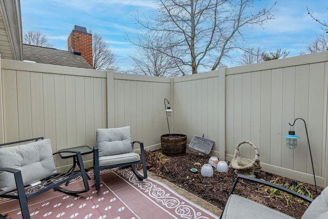 view of patio featuring fence