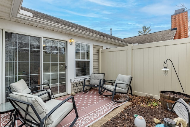 view of patio featuring fence