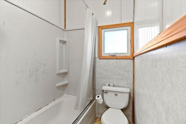 bathroom featuring toilet and shower / bath combo