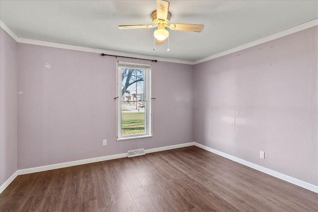 unfurnished room with ornamental molding, hardwood / wood-style floors, and ceiling fan