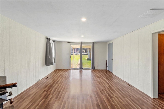 spare room with wood-type flooring