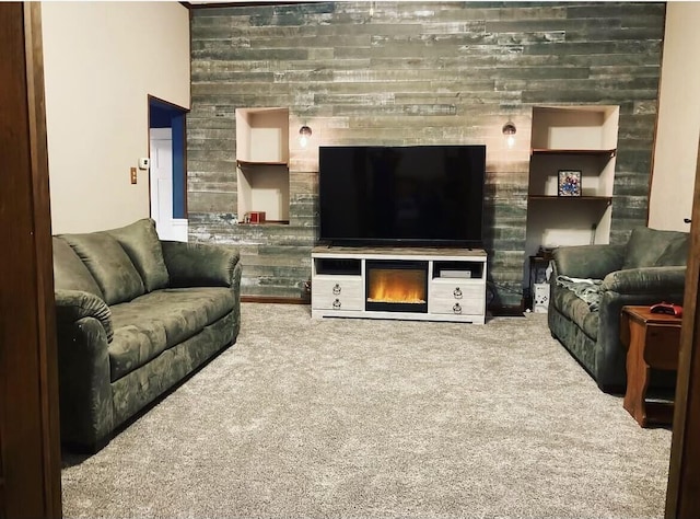 23 E Columbus Rd, South Charleston, OH 45368 - living area with carpet and a glass covered fireplace