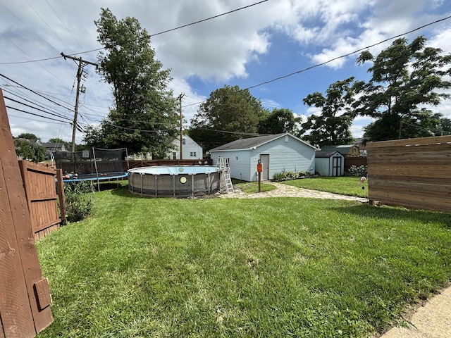 23 E Columbus Rd, South Charleston, OH 45368 - view of yard featuring a trampoline and a storage shed