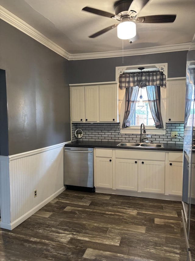 23 E Columbus Rd, South Charleston, OH 45368 - kitchen with dishwasher, dark wood-style floors, ceiling fan, dark countertops, and wainscoting