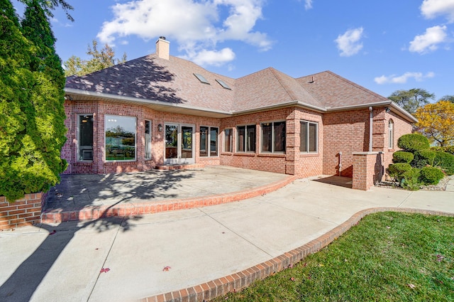 rear view of house featuring a patio