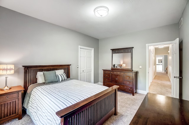 bedroom featuring light carpet