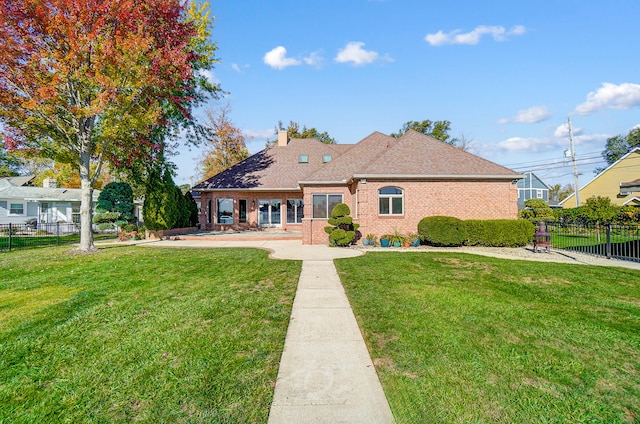 back of house featuring a yard