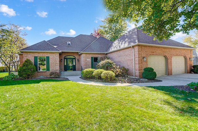 view of front of home featuring a garage and a front yard