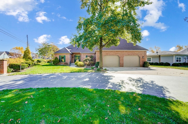 view of front of home with a garage and a front yard