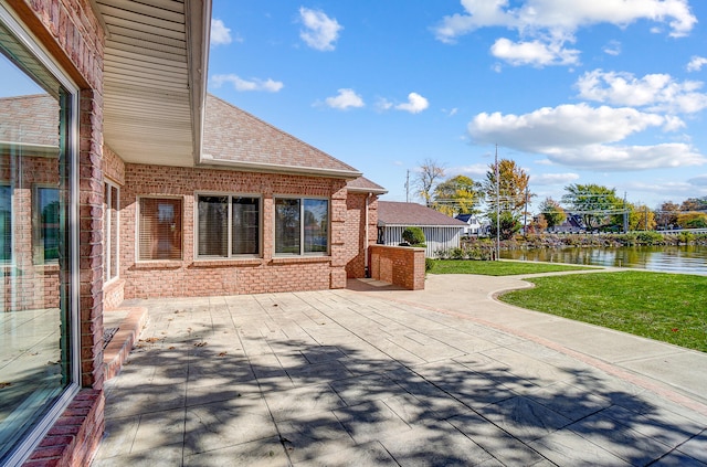 view of patio with a water view