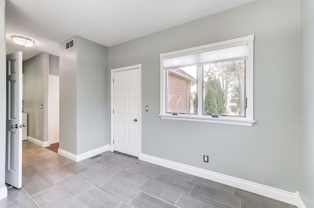 interior space with light tile patterned flooring