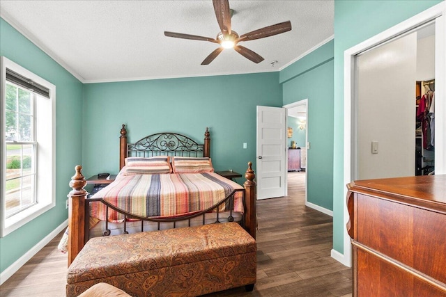 11372 Powhatan Path, Lakeview, OH 43331 - bedroom with wood finished floors, crown molding, a textured ceiling, and ceiling fan