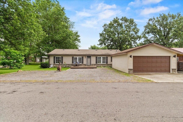 11372 Powhatan Path, Lakeview, OH 43331 - ranch-style home with driveway, an attached garage, and stone siding