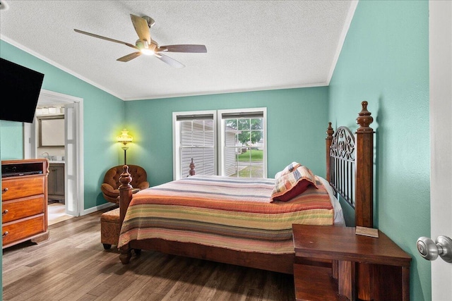 11372 Powhatan Path, Lakeview, OH 43331 - bedroom with light wood-style flooring, a textured ceiling, crown molding, lofted ceiling, and ensuite bath