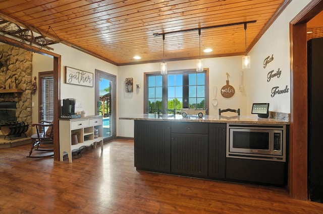 891 N Tecumseh Rd, Springfield, OH 45504 - kitchen featuring stainless steel microwave, wooden ceiling, crown molding, a peninsula, and pendant lighting