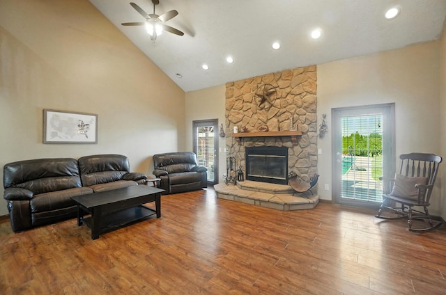 891 N Tecumseh Rd, Springfield, OH 45504 - living area featuring high vaulted ceiling, wood finished floors, a ceiling fan, a fireplace, and recessed lighting