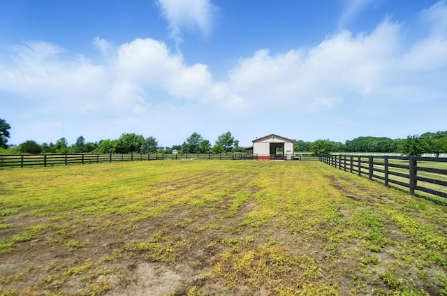 891 N Tecumseh Rd, Springfield, OH 45504 - view of yard with a rural view, an outdoor structure, and an exterior structure