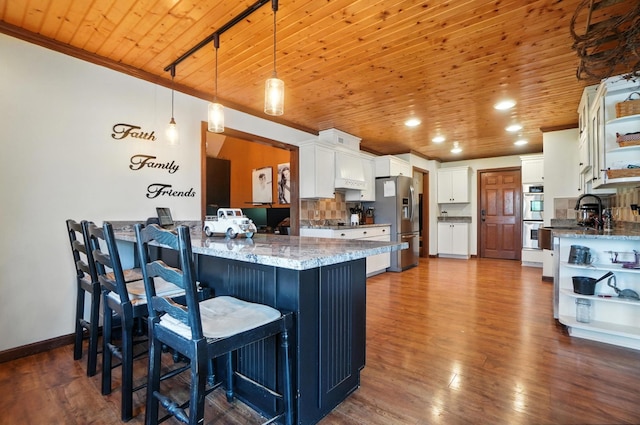 891 N Tecumseh Rd, Springfield, OH 45504 - kitchen featuring appliances with stainless steel finishes, open shelves, wooden ceiling, a peninsula, and white cabinets