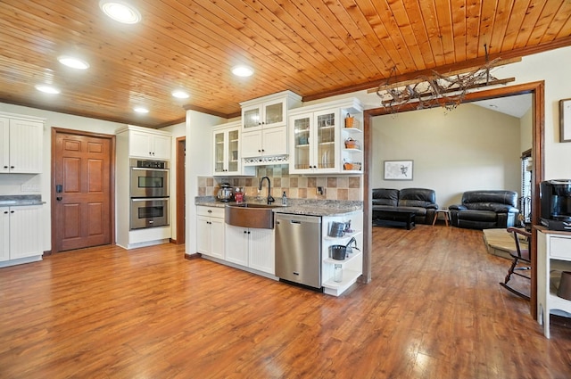 891 N Tecumseh Rd, Springfield, OH 45504 - kitchen with stainless steel appliances, open floor plan, wood finished floors, wood ceiling, and white cabinets