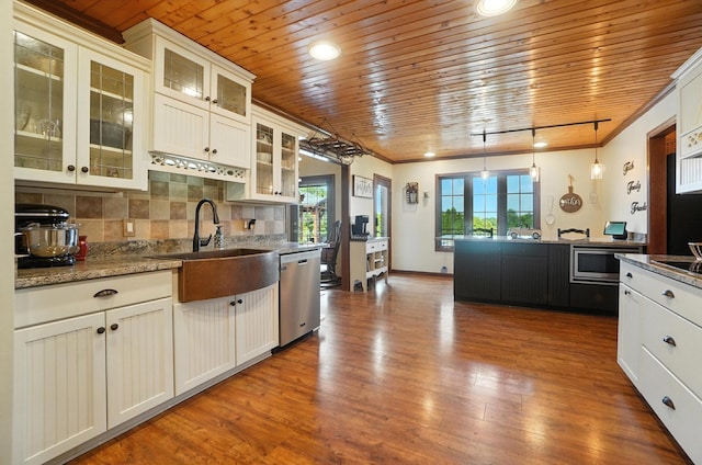 891 N Tecumseh Rd, Springfield, OH 45504 - kitchen with dishwasher, wood ceiling, wood finished floors, backsplash, and pendant lighting