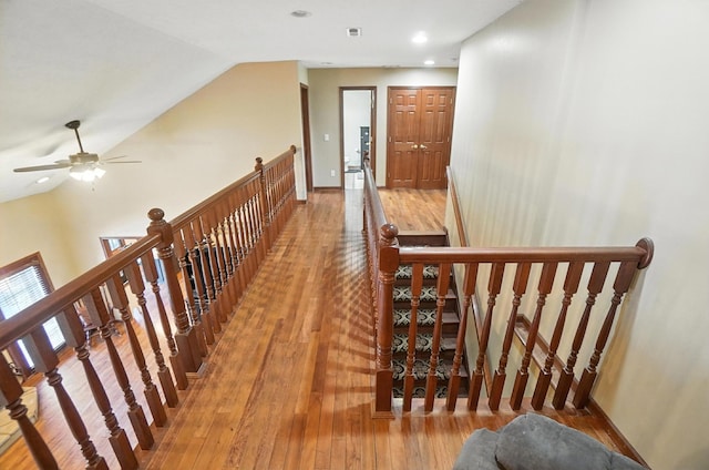 891 N Tecumseh Rd, Springfield, OH 45504 - hall with an upstairs landing, wood-type flooring, lofted ceiling, and recessed lighting