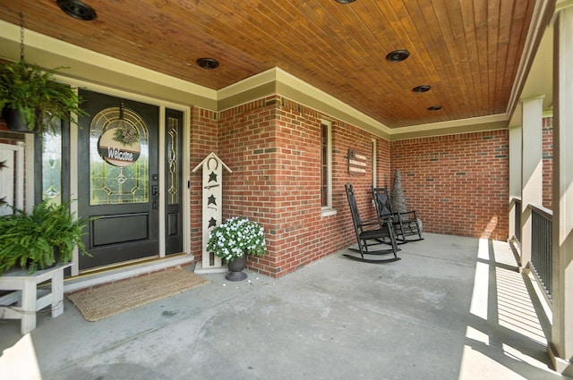 891 N Tecumseh Rd, Springfield, OH 45504 - doorway to property with a porch and brick siding