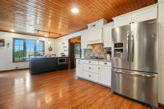 891 N Tecumseh Rd, Springfield, OH 45504 - kitchen with stainless steel appliances, wood ceiling, white cabinetry, wood finished floors, and decorative backsplash