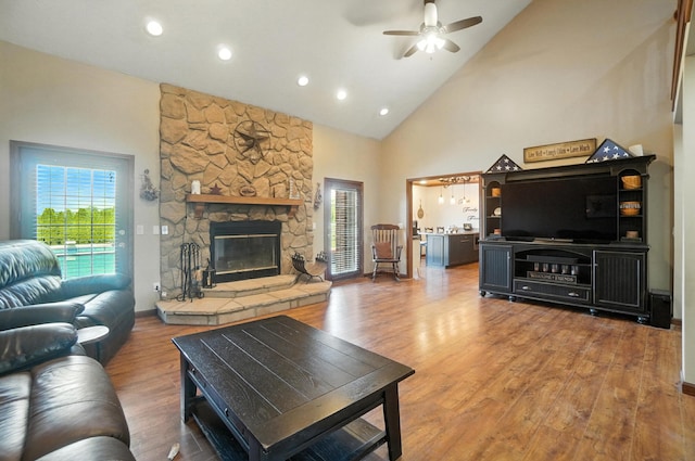 891 N Tecumseh Rd, Springfield, OH 45504 - living room with a ceiling fan, high vaulted ceiling, light wood-type flooring, recessed lighting, and a fireplace