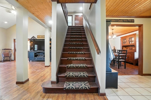 891 N Tecumseh Rd, Springfield, OH 45504 - stairs with wood finished floors, a chandelier, wooden ceiling, ornamental molding, and lofted ceiling