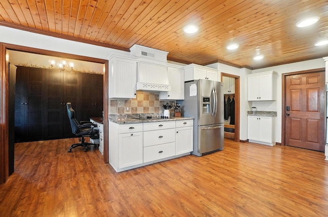 891 N Tecumseh Rd, Springfield, OH 45504 - kitchen with stainless steel fridge with ice dispenser, custom range hood, tasteful backsplash, ornamental molding, and white cabinets