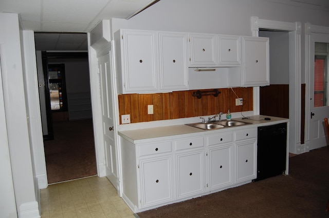 kitchen with a sink, white cabinets, dishwasher, and light countertops