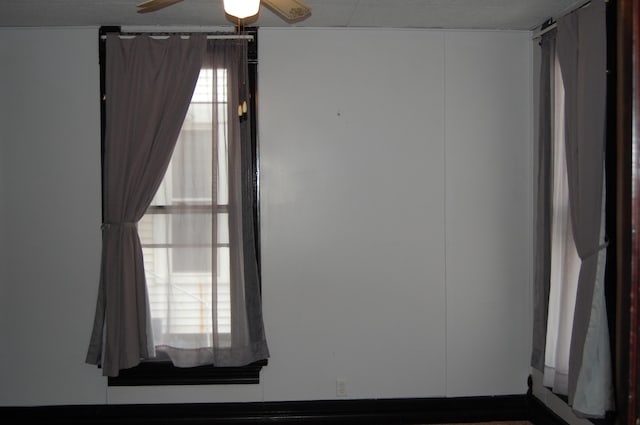 spare room with ceiling fan