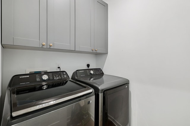 8202 Cherry Birch Dr, Tipp City, OH 45371 - washroom with cabinet space and washing machine and clothes dryer