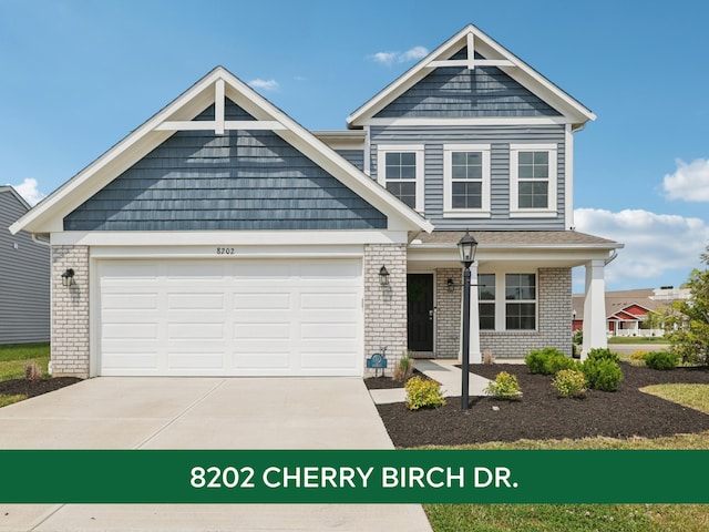 8202 Cherry Birch Dr, Tipp City, OH 45371 - craftsman house featuring brick siding, driveway, an attached garage, and a porch
