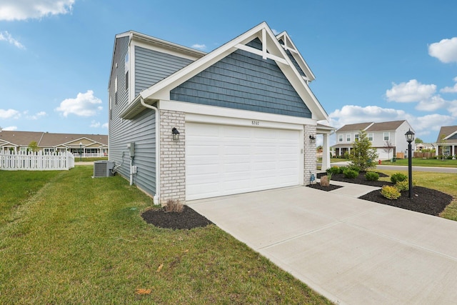 8202 Cherry Birch Dr, Tipp City, OH 45371 - view of side of property with driveway, a garage, a residential view, and brick siding