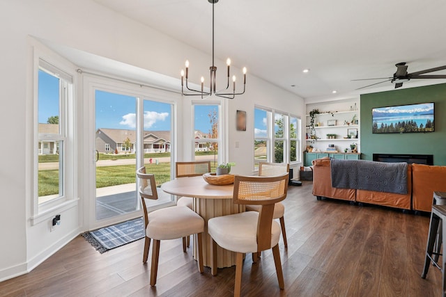 8202 Cherry Birch Dr, Tipp City, OH 45371 - dining room featuring dark wood-style floors, a chandelier, recessed lighting, ceiling fan, and built in features