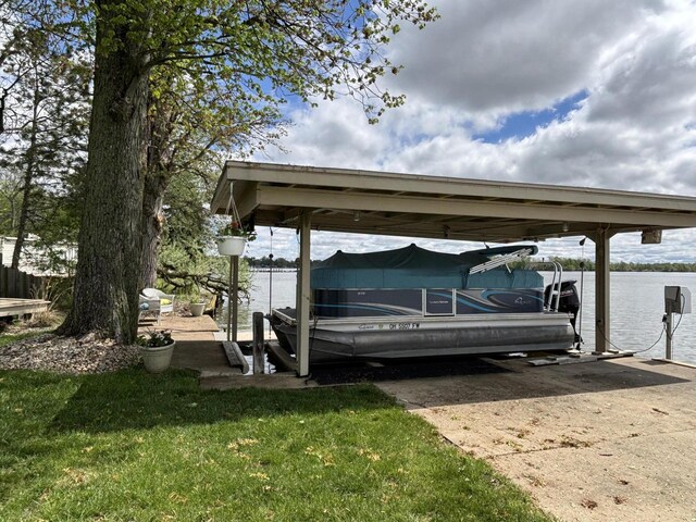 14072 Seminole Path, Lakeview, OH 43331 - view of parking / parking lot featuring boat lift, a dock, a carport, and a water view