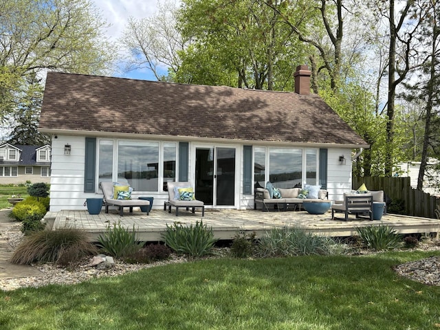14072 Seminole Path, Lakeview, OH 43331 - rear view of house with an outdoor hangout area, a deck, a chimney, and roof with shingles