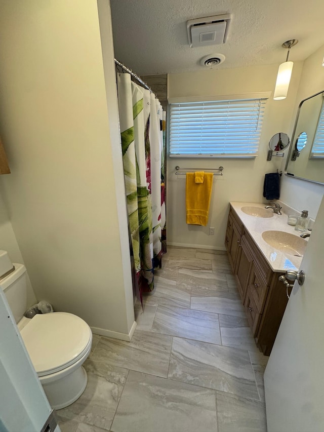 14072 Seminole Path, Lakeview, OH 43331 - full bath featuring toilet, marble finish floors, baseboards, double vanity, and curtained shower