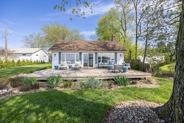 14072 Seminole Path, Lakeview, OH 43331 - back of property with an outdoor hangout area, a deck, and a chimney