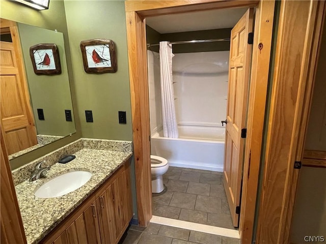 full bathroom with vanity, tile flooring, shower / bath combo with shower curtain, and toilet