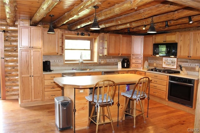 kitchen featuring pendant lighting, a center island, wooden ceiling, beamed ceiling, and black appliances