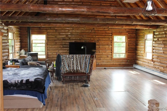 bedroom featuring a baseboard heating unit, log walls, dark hardwood / wood-style floors, and beamed ceiling