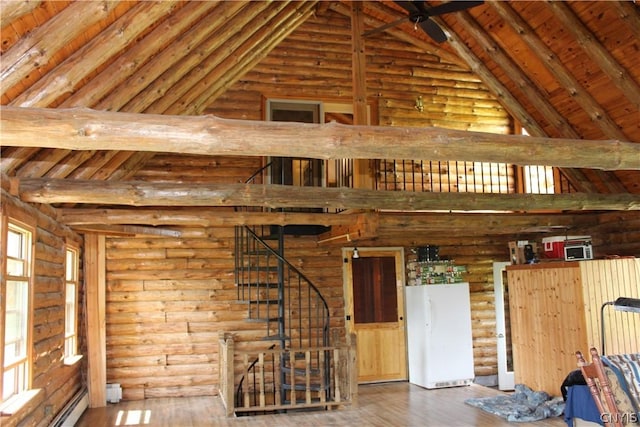 misc room with dark hardwood / wood-style floors and log walls