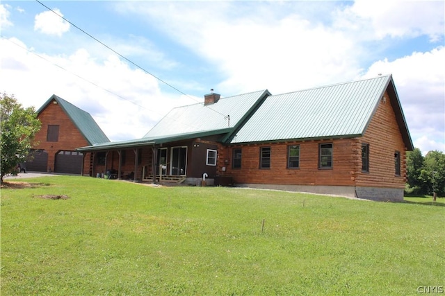 rear view of property with a lawn